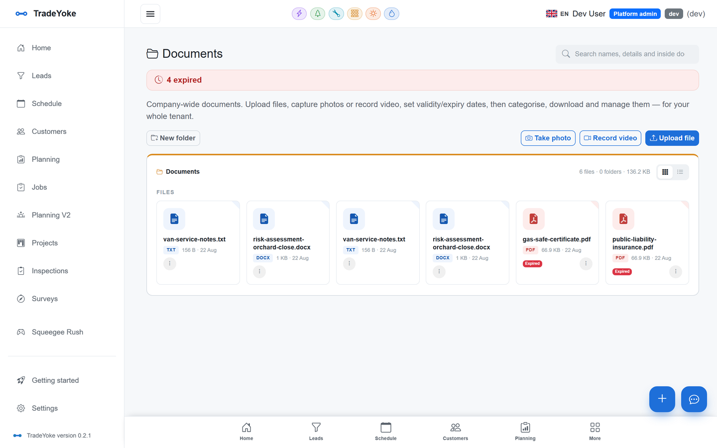TradeYoke document library with folders, expiry warnings, photo and video capture
