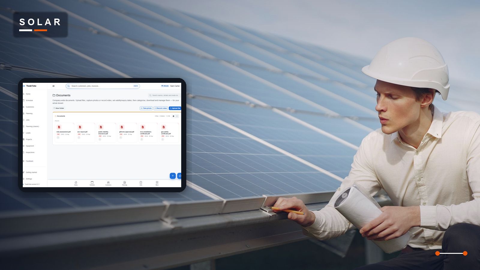 A solar installer signing off a rooftop installation, beside TradeYoke's document library holding the MCS certificate